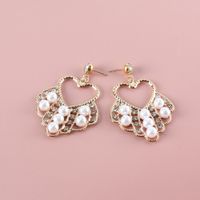 Fashion Pearl Geometric Hollow Heart Inlaid Rhinestone Metal Earrings Wholesale Nihaojewelry main image 5