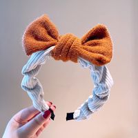 South Korea's Dongdaemun Autumn And Winter New Knitted Bowknot Contrasting Color Headband Western Simple Temperament Pressure Hair Sweet Headband sku image 3