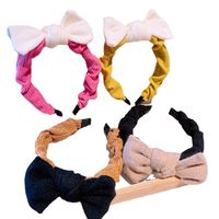 South Korea's Dongdaemun Autumn And Winter New Knitted Bowknot Contrasting Color Headband Western Simple Temperament Pressure Hair Sweet Headband main image 3