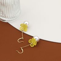 Classic Fashion Hollow Solid Color Flower Pearl Earrings main image 1