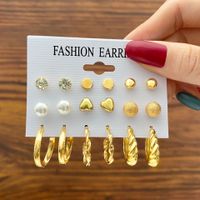 Creative Simple Pearl Peach Heart Twisted Twill C-shaped Stud Earrings Set 9 Pieces main image 1