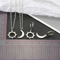 Corée Simple Alliage Creux Soleil Lune Boucles D&#39;oreilles Asymétriques Collier En Gros main image 6