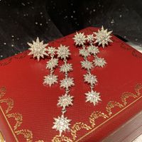 Fashion Eight-pointed Star Long Tassel Inlaid Zircon Copper Snowflake Earrings main image 4