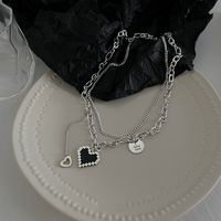 Korean Retro Heart Dyed Black Stacked Thollow Design English Collarbone Chain Female main image 5