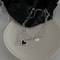 Korean Retro Heart Dyed Black Stacked Thollow Design English Collarbone Chain Female sku image 1