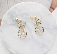 Fashion Geometric Solid Color Hollow Bow Pearl Earrings main image 2