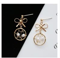 Fashion Geometric Solid Color Hollow Bow Pearl Earrings main image 3