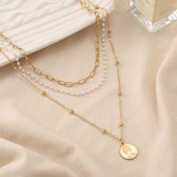 2022 New Creative Simple Women's Portrait Coin Chain Pearl Three-layer Necklace Wholesale main image 5