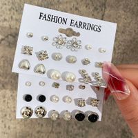Simple Style Geometric Alloy Inlay Artificial Pearls Rhinestones Unisex Earrings 9 Pairs main image 1