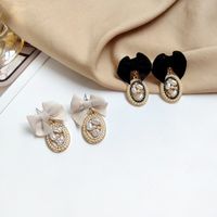 Elegant Bow Knot Inlay Alloy Pearl Drop Earrings sku image 2