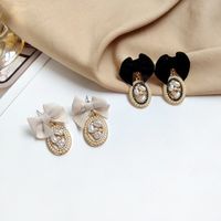 Elegant Bow Knot Inlay Alloy Pearl Drop Earrings sku image 3