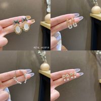 Sweet Star Flower Bow Knot Alloy Inlay Artificial Pearls Rhinestones Women's Earrings 1 Pair main image 3