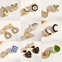 Fashion Round Heart Shape Flower Brass Inlay Artificial Pearls Rhinestones Opal Ear Clips 1 Pair main image 1