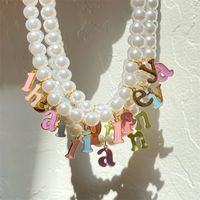 Großhandel Schmuck Mode Brief Edelstahl 302 Künstliche Perle Perlen Überzug Halskette Mit Anhänger main image 1