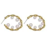 Pure White Pearl Inlaid Wavy Round Hollow Creative Fashion Earrings Wholesale sku image 2