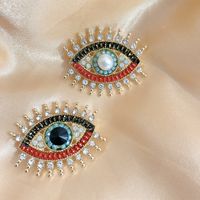 Retro Devil's Eye Alloy Pearl Inlay Artificial Gemstones Unisex Brooches main image 1