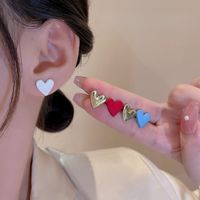Fashion Heart Shape Alloy Asymmetrical Spray Paint Plating Women's Ear Studs 1 Pair main image 6