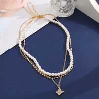 Retro Full Rhinestone Butterfly Pearl Three-layer Gold Alloy Necklace Wholesale main image 3