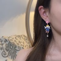 Korean Imitation Pearl Flower Angel Earrings Fashion Dripping Oil Earrings main image 5