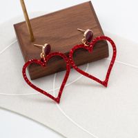 Vintage Inlaid Rhinestone Hollow Red Heart Shaped Metal Earrings main image 1