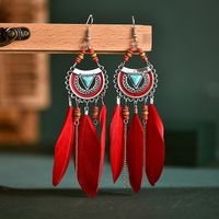 Fashion Fan-shaped Imitation Turquoise Tassel Long Rice Bead Feather Earrings Wholesale main image 1