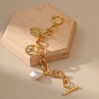 Baroque Irregular Hollow Chain Inlaid Pearl Heart Shaped Peace Pendant Bracelet main image 3