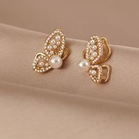 Fashion Hollow Three-dimensional Butterfly Pearl Earrings Wholesale main image 1
