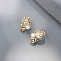 Fashion Hollow Three-dimensional Butterfly Pearl Earrings Wholesale main image 3