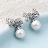 Fashion Classic Copper Inlaid Zircon Bow Pearl Stud Earrings main image 1