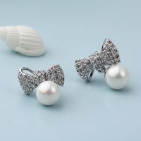 Fashion Classic Copper Inlaid Zircon Bow Pearl Stud Earrings main image 3