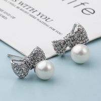 Fashion Classic Copper Inlaid Zircon Bow Pearl Stud Earrings main image 6