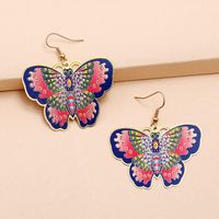 Printed New Fashion Exaggerated Butterfly Dripping Oil Flower Copper Earrings main image 3