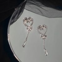 Fashion Bows Heart Shaped Hollowed Tassel Sweet Girl Alloy Earrings sku image 1