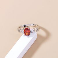 Einfacher Ovaler Ring Mit Rotem Zirkon Einfacher Kupferring Mit Zirkon In Mikrofassung main image 6