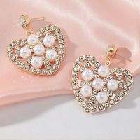 Fashion Hollow Heart Shaped Inlaid Pearl Diamond Metal Drop Earrings main image 3