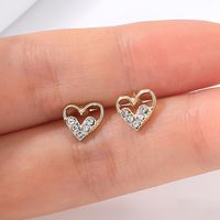 Classic Fashion Gold Hollow Heart Rhinestone Metal Women's Stud Earrings main image 6