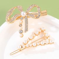 2-teiliges Mode-goldenes Vintage-perlen-strass-bogen-dreieck-haarspangen-set Für Frauen main image 1