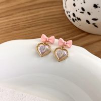 Korean Cherry Blossom Powder Bow Pearl Heart Earrings sku image 1