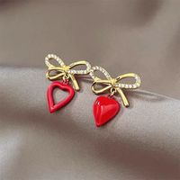 Korean Style Heart Shaped Hollowed Bows Alloy Stud Earrings Wholesale main image 1