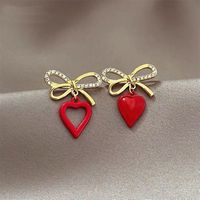 Korean Style Heart Shaped Hollowed Bows Alloy Stud Earrings Wholesale main image 4