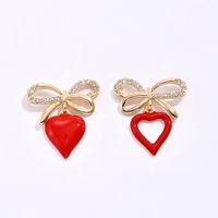 Korean Style Heart Shaped Hollowed Bows Alloy Stud Earrings Wholesale main image 6