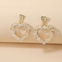 Korean Style Inlaid Crystal Heart Shaped Hollowed Alloy Stud Earrings Wholesale main image 2