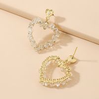 Korean Style Inlaid Crystal Heart Shaped Hollowed Alloy Stud Earrings Wholesale main image 4