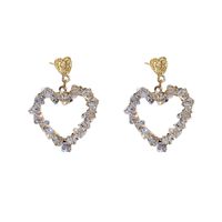 Korean Style Inlaid Crystal Heart Shaped Hollowed Alloy Stud Earrings Wholesale main image 6