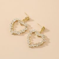 Korean Style Inlaid Crystal Heart Shaped Hollowed Alloy Stud Earrings Wholesale sku image 1