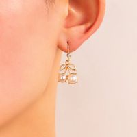 Boucles D&#39;oreilles En Alliage De Zircon Perle Incrustées En Forme D&#39;arc De Style Coréen En Gros main image 2