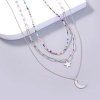 Mode Nouveau Bijoux Étoile Lune Élément Pendentif Perle De Riz Chaîne En Treillis Multicouche Collier En Couches 2 sku image 1