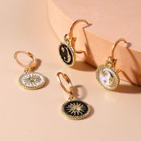 Fashion Sun God Moon Pattern Metal Earrings main image 1