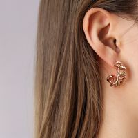 Fashion Twist Hollow C- Shaped Female Titanium Steel Plated 18k Real Gold Stud Earrings main image 4