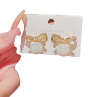 Exquisite Delicate Mermaid Pearl Inlaid Butterfly Bow Earrings main image 2